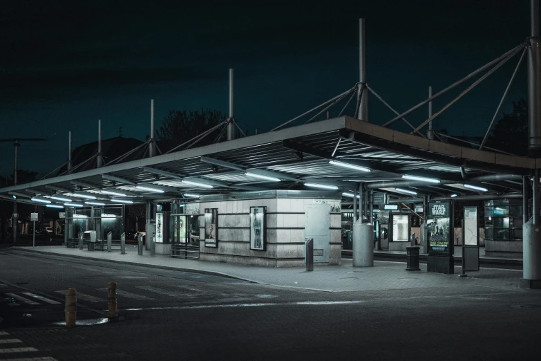 a black and white photo of a bus stop at night, by Adam Marczyński, unsplash contest winner, hyperrealism, bus station, canopies, ilustration, paul barson