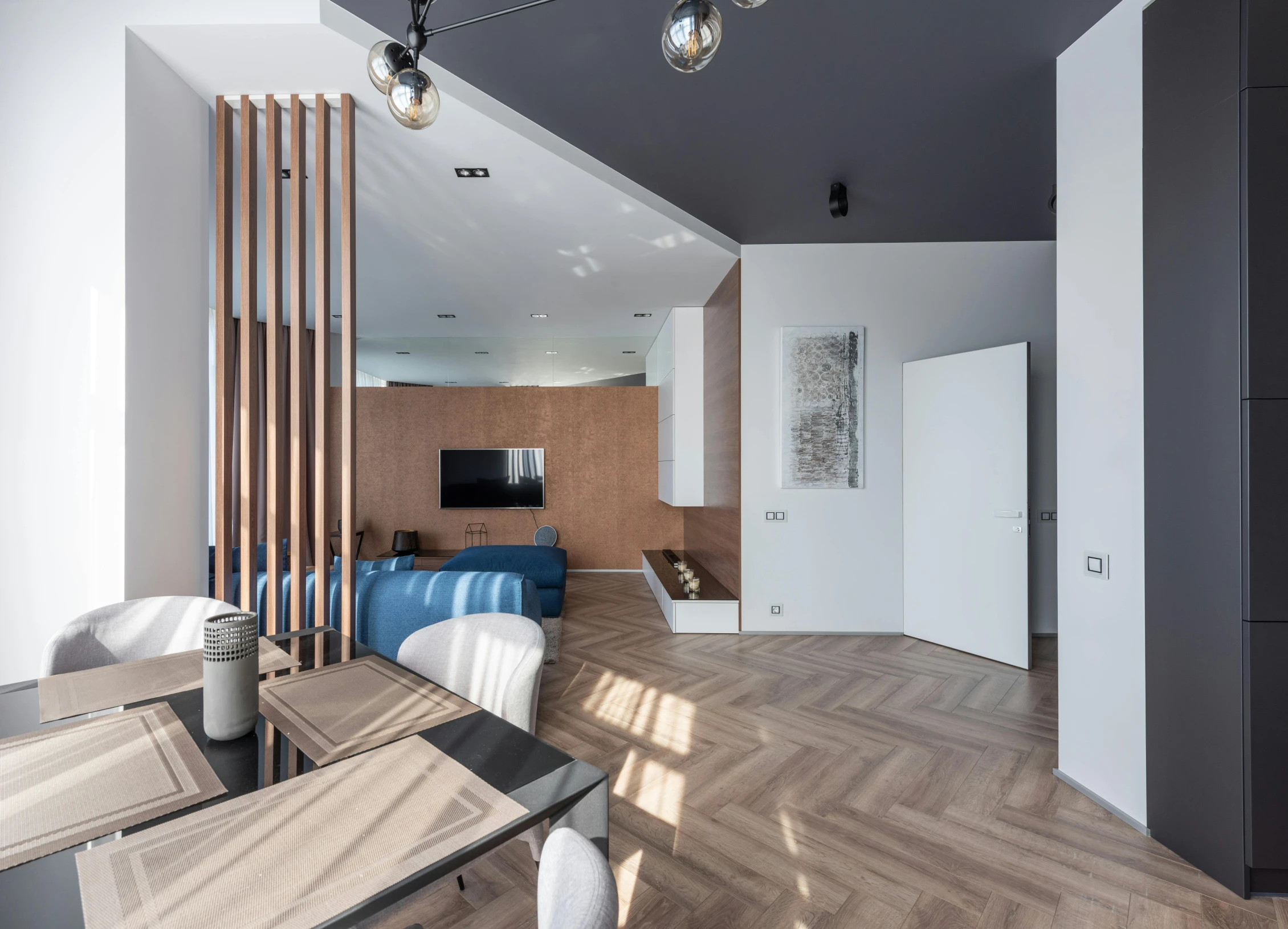 a living room filled with furniture and a flat screen tv, by Adam Marczyński, pexels contest winner, light and space, herringbone floor, tall entry, modern house in the wood, curvy build