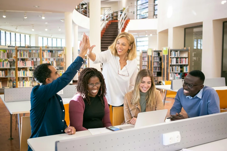 a group of people sitting at a table in a library, pexels contest winner, academic art, standing triumphant and proud, avatar image, high resolution image, raised hand