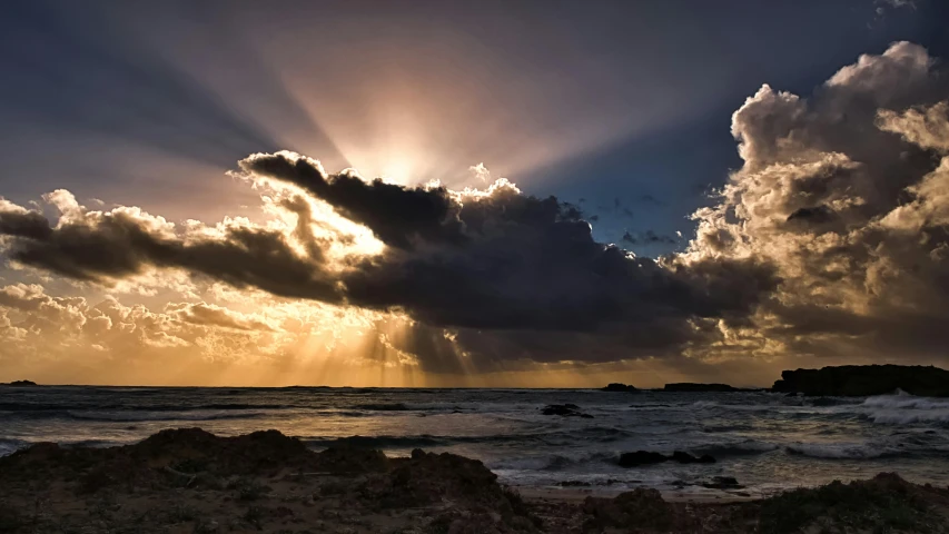 the sun is shining through the clouds over the ocean, a picture, by Peter Churcher, unsplash contest winner, light ray, backlite, today\'s featured photograph 4k, sunset lighting 8k