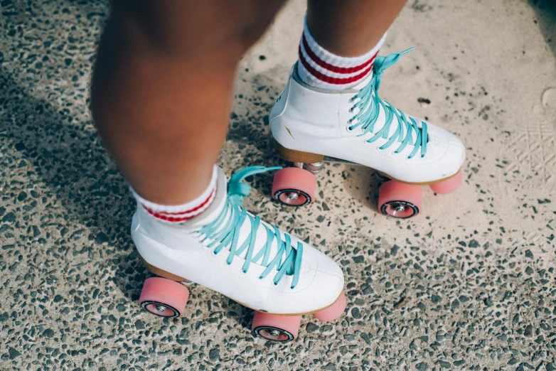 a close up of a person wearing roller skates, by Julia Pishtar, trending on unsplash, pink white turquoise, 3/4 view from below, sydney sweeney, holiday season