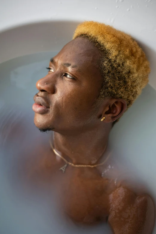 a close up of a person in a bath tub, by Jessie Alexandra Dick, emmanuel shiru, blonde guy, full frame image, transparent goo