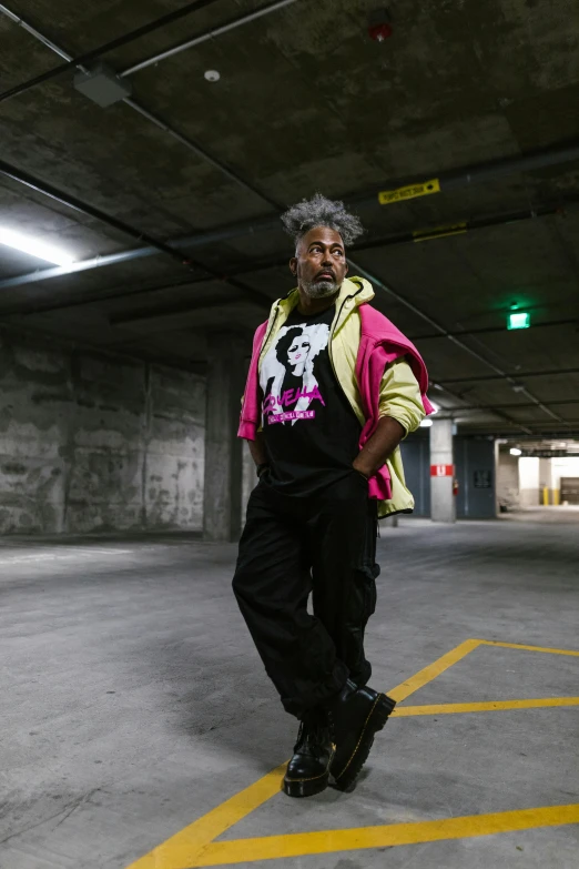 a man standing in a parking garage next to a fire hydrant, by Winona Nelson, happening, george clinton, zack de la rocha, wearing japanese techwear, in australia