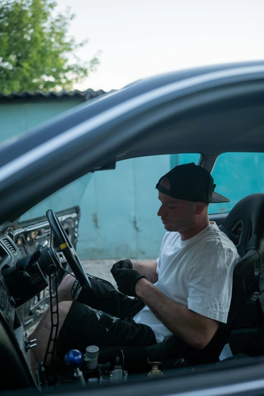 a man sitting in the driver's seat of a car, by Andrew Stevovich, cuban setting, tuning, japanese drift car, profile image