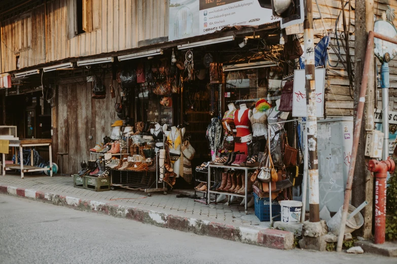 a store sitting on the side of a road, pexels contest winner, middle eastern style vendors, leather clothing, antiques, thumbnail