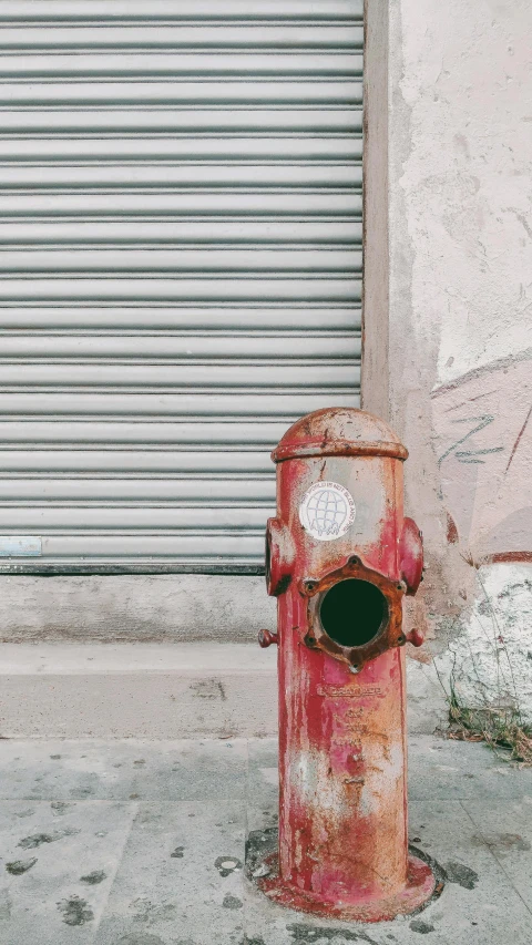 a red fire hydrant sitting on the side of a road, inspired by Elsa Bleda, pexels contest winner, street art, faded worn, instagram story, made of metal, pipes