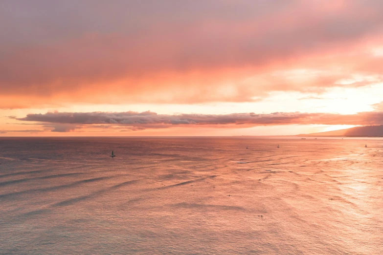 a large body of water with a sunset in the background, unsplash contest winner, romanticism, soft light 4 k in pink, waikiki beach, shipfleet on the horizon, birdseye view