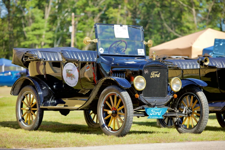 a couple of antique cars parked next to each other, a portrait, flickr, ford model t, tournament, 2022 photograph, new hampshire