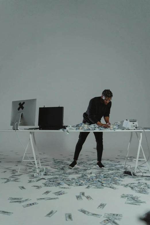 a man standing in front of a desk covered in money, a computer rendering, by artist, pexels contest winner, video art, live performance, minimalistic, sitting on a table, julia sarda