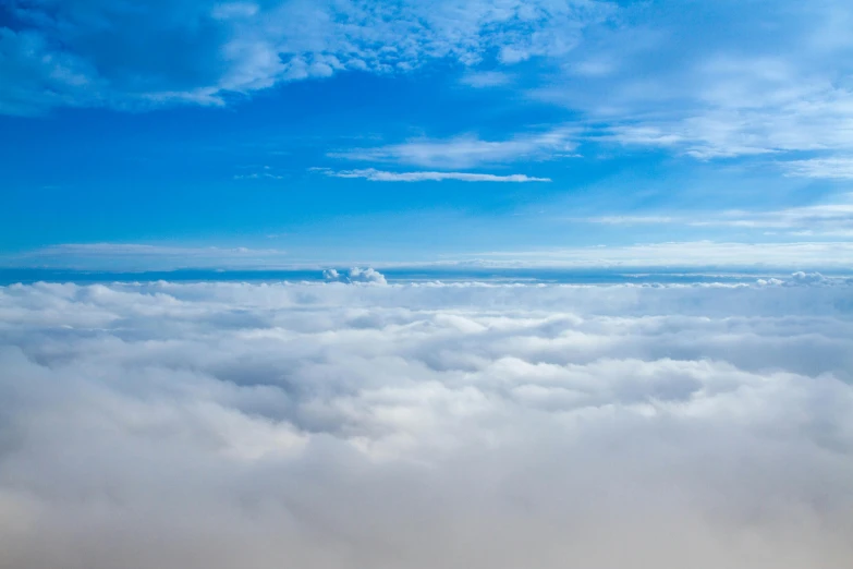 a blue sky filled with lots of white clouds, by Niko Henrichon, pexels contest winner, bird's eye view, low fog layer, today\'s featured photograph 4k, azure blue sky