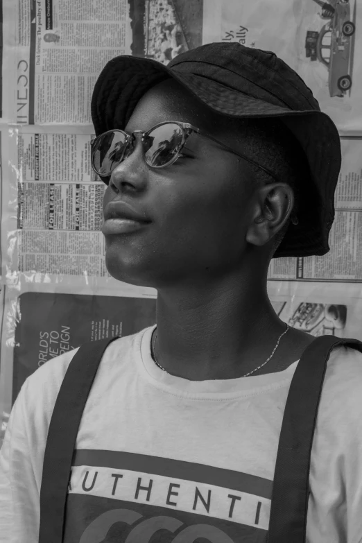 a black and white photo of a man wearing a hat and sunglasses, by Lily Delissa Joseph, afrofuturism, black teenage girl, clean shaven, ((portrait)), detailed with high quality
