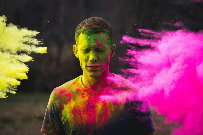 a man is throwing colored powder into the air, a colorized photo, inspired by Sam Spratt, pexels contest winner, portrait happy colors, grungy; colorful, neon colored, instagram post