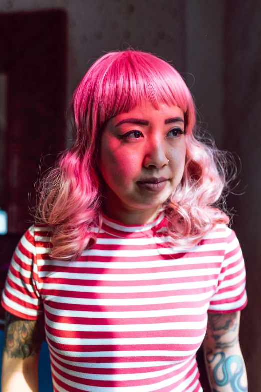 a woman with pink hair wearing a striped shirt, inspired by Yuko Tatsushima, bisexual lighting, bao pham, promo photo, brightly lit