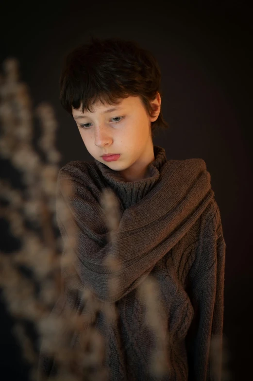 a young boy with a scarf around his neck, an album cover, by Maeda Seison, unsplash, soft lighting 8k, brown sweater, very pretty model, ((tatsuro yamashita))