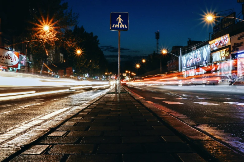 a city street filled with lots of traffic at night, by Adam Marczyński, unsplash contest winner, graffiti, traffic signs, crosswalk, thumbnail, clean image