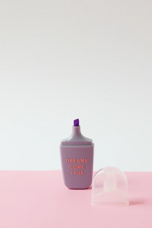 a bottle of liquid sitting on top of a pink surface, d-cup, light grey, vinyl designer toy, lilac