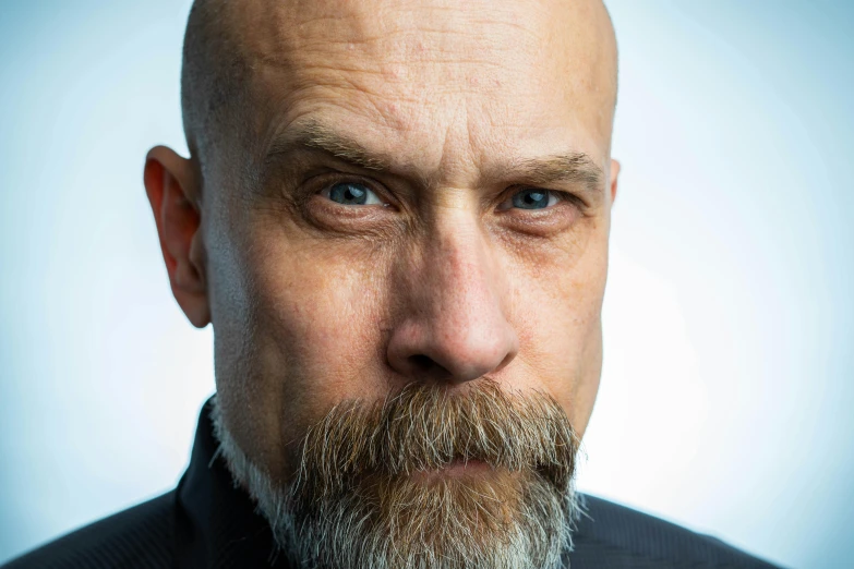a close up of a man with a beard, unsplash, hyperrealism, portrait of bald, christoph waltz, square masculine facial features, adafruit