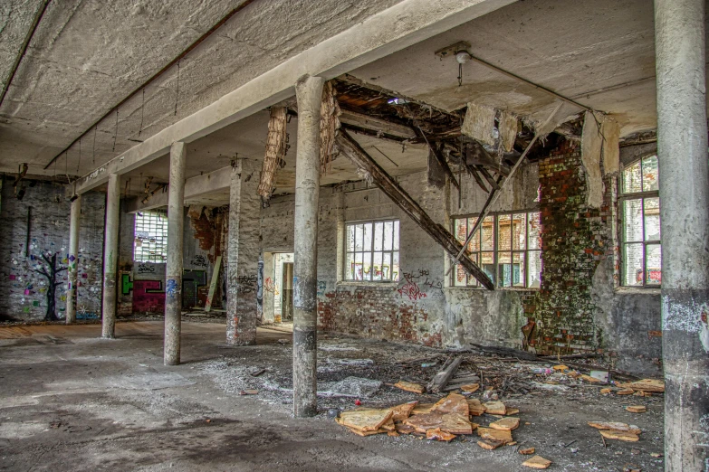 a building that has a bunch of windows in it, a colorized photo, by Arnie Swekel, pexels contest winner, process art, brick debris, open ceiling, ((rust)), fallen columns