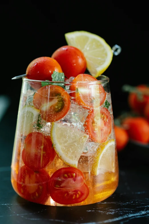 a pitcher filled with sliced tomatoes and lemons, by Tom Bonson, pexels, cocktail in an engraved glass, snacks, striking pose, “berries