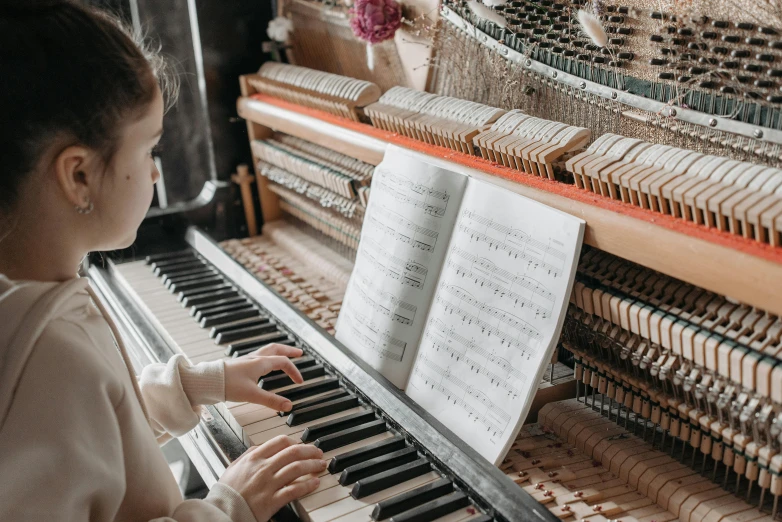 a little girl that is playing a piano, an album cover, pexels contest winner, nerdy music teacher with phd, 15081959 21121991 01012000 4k, lachlan bailey, its detailed intricate