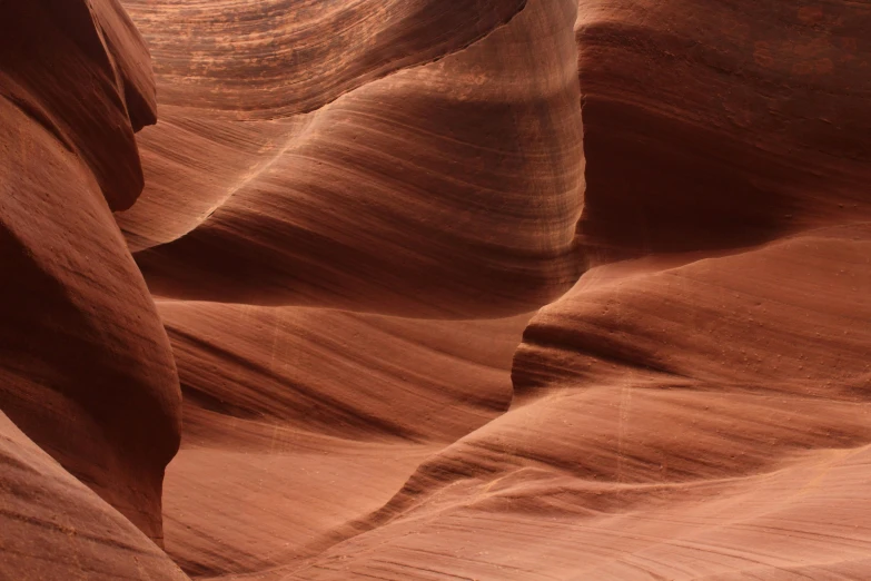 a large rock formation in the middle of a desert, by Jessie Algie, pexels contest winner, art nouveau, antelope canyon, closeup - view, brown, pastelwave