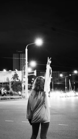a black and white photo of a person on a skateboard, a black and white photo, unsplash, realism, holding up a night lamp, peace sign, 000 — википедия, intersection