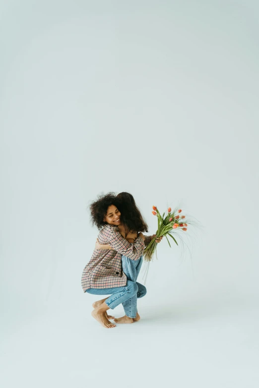 a little girl kneeling down holding a bunch of flowers, by Jessie Algie, minimalism, imaan hammam, hugs, jovana rikalo, casually dressed