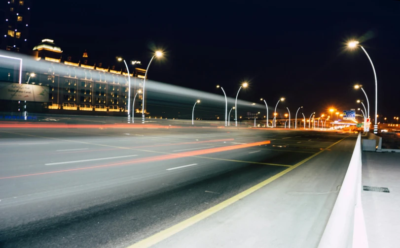 a city street filled with lots of traffic at night, pexels contest winner, hyperrealism, laser beam ; outdoor, jeddah city street, mies van der rohe, light beam