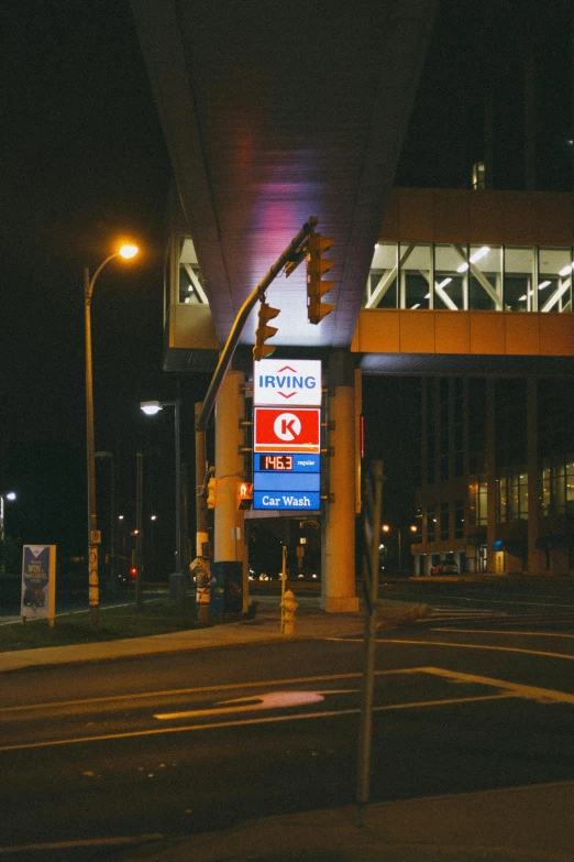 a traffic light sitting on the side of a road, spaceport docking bay at night, “gas station photography, yeg, square