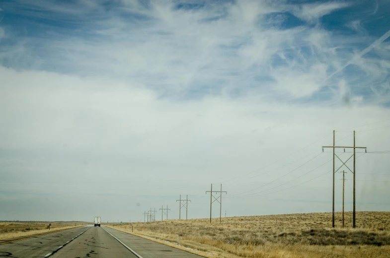 an empty road with power lines in the distance, a portrait, unsplash, wyoming, large scale photo, fan favorite, hyperdetailed photo