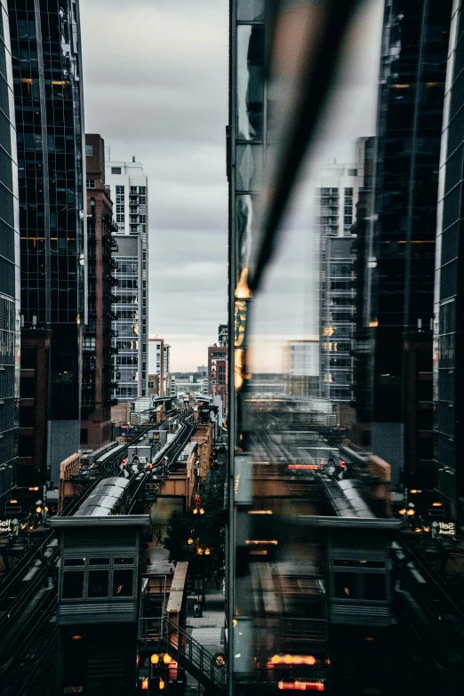 a city filled with lots of tall buildings, a picture, unsplash contest winner, modernism, train window, modern chicago streets, stacked image, fps view