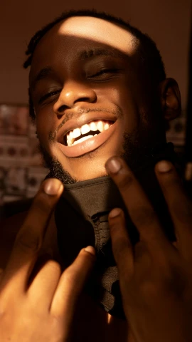 a close up of a person tying a tie, an album cover, inspired by Paul Georges, trending on pexels, brown skin man with a giant grin, bladee from drain gang, glowing mouth, satisfied pose
