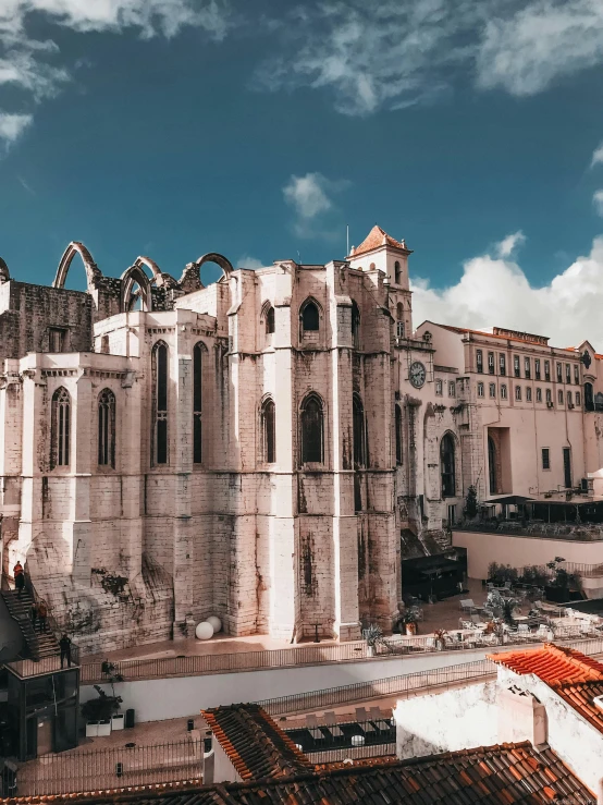 a large white building with a blue sky in the background, a detailed matte painting, pexels contest winner, renaissance, lisbon, old abbey in the background, front back view and side view, wide angle exterior 2022