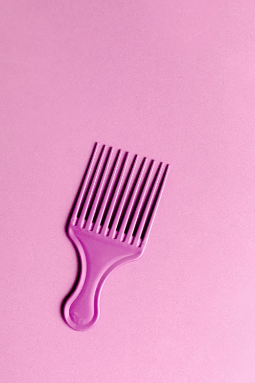 a purple comb on a pink background, trending on pexels, plasticien, black fork, purple liquid, afro, mint