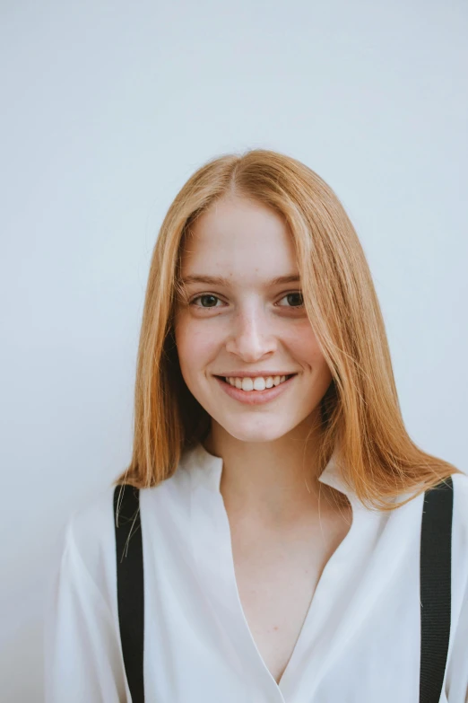 a woman in a white shirt and black suspenders, a character portrait, pexels contest winner, portrait of white teenage girl, clear background, friedly smile, hr ginger