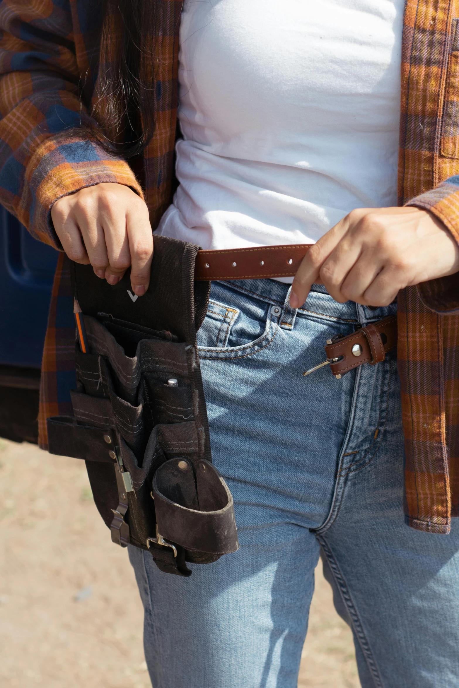 a close up of a person wearing a belt, by Ben Zoeller, holster, sydney sweeney, set pieces, maintenance