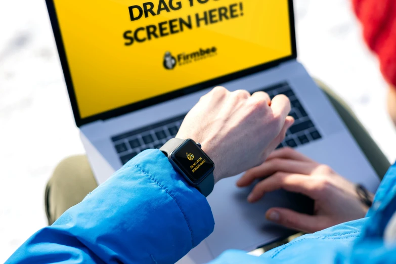 a person sitting in front of a laptop computer, pexels, with a bright yellow aureola, funtime corporation branding, large screen, watch photo