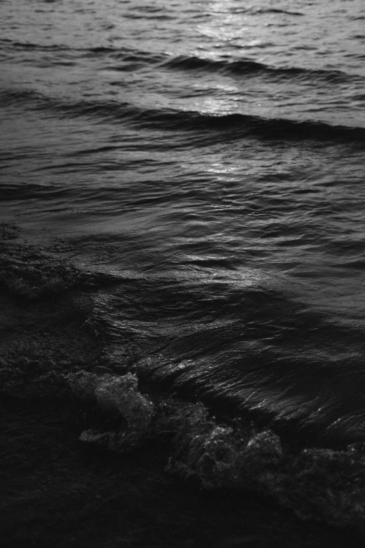 a black and white photo of the ocean, inspired by Max Dupain, renaissance, glowing water with caustics, dusk, masami kurumada, ignant