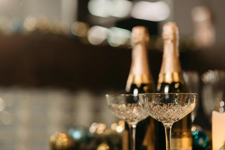 a group of wine glasses sitting on top of a table, pexels contest winner, happening, champagne, gold, lounge background, thumbnail