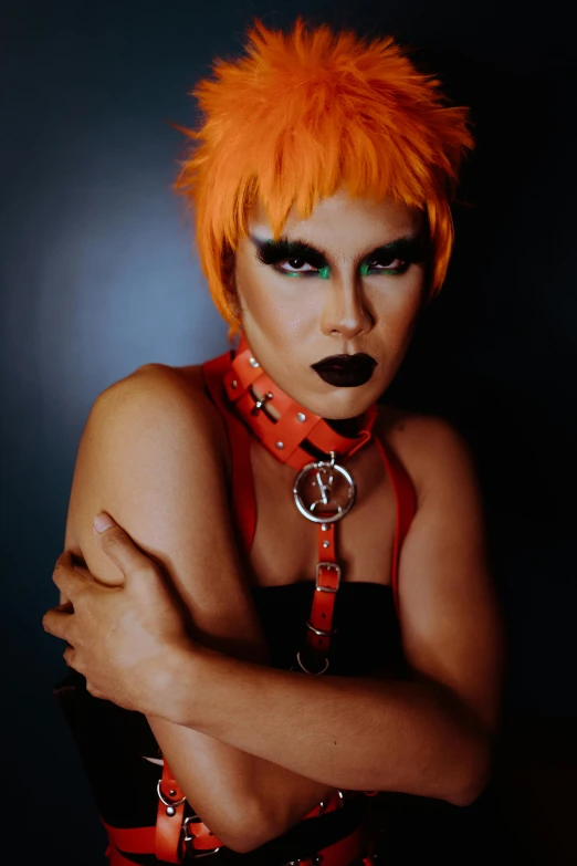 a woman with orange hair posing for a picture, an album cover, inspired by Sebastian Vrancx, trending on pexels, black leather harness, queer, dio brando, official store photo