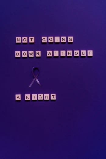 a sign that says not going down without a fight, by Alison Geissler, pexels contest winner, conceptual art, purple ribbons, disease, panel, instagram post