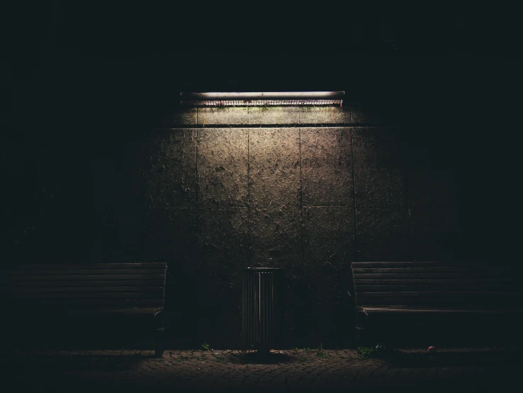 a couple of benches sitting next to each other in a dark room, pexels contest winner, street light, instagram picture, blank, abandoned bus stop