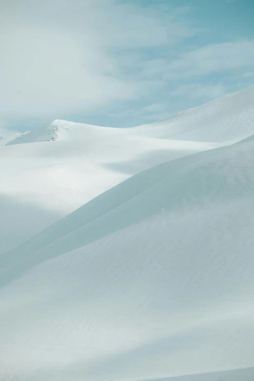 a man riding a snowboard down the side of a snow covered slope, by Daniel Seghers, hurufiyya, epic land formations, covered!