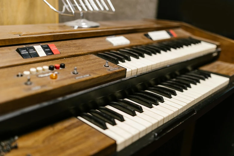 a close up of a keyboard in a room, inspired by Bryan Organ, mellotron, professional studio shot, brown, mint