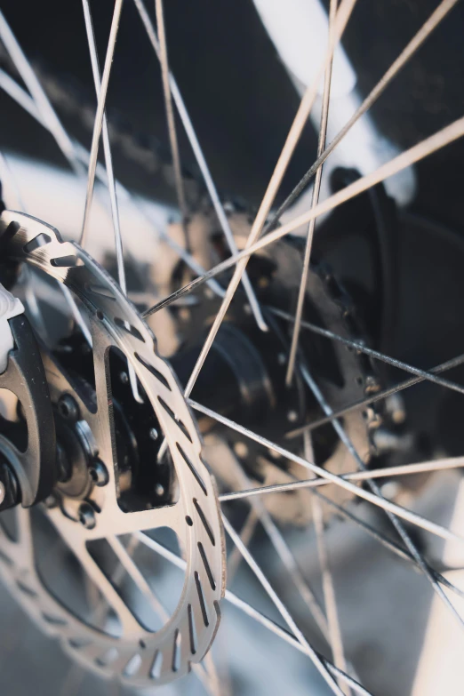 a close up of the front wheel of a bicycle, a digital rendering, unsplash, aluminum, multi-part, graphic”