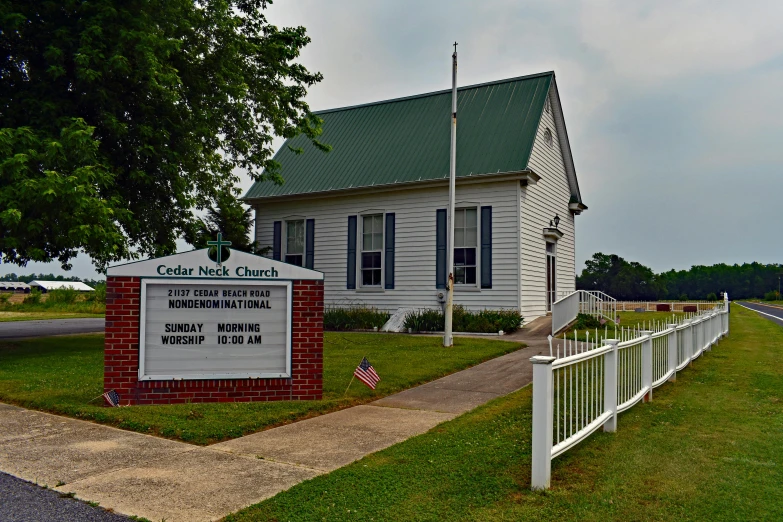 a church with a sign in front of it, profile image, alabama, chuck, porcelain holly herndon statue