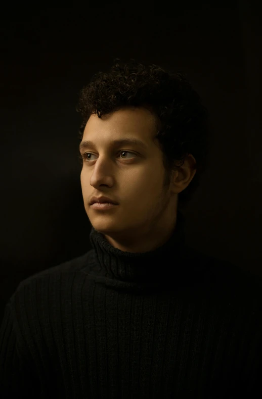 a man in a black turtle neck sweater, an album cover, by irakli nadar, pexels contest winner, frontal portrait of a young, raden saleh, taken in the late 2010s, looking to his left