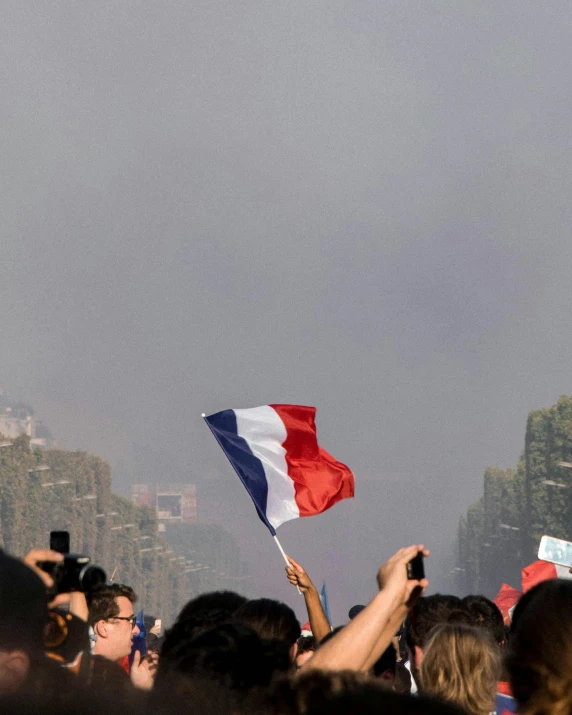 a crowd of people standing on top of a street, an album cover, trending on unsplash, paris school, lgbt flag, very smoky, emmanuel macron, 15081959 21121991 01012000 4k