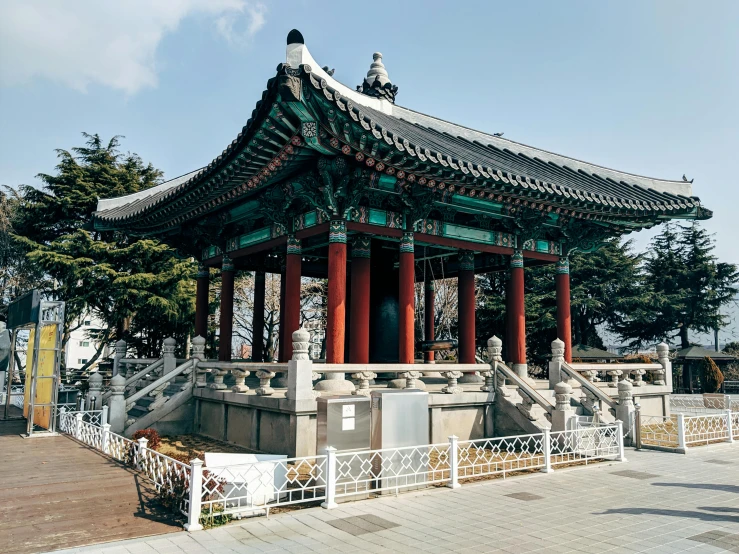 a building sitting on the side of a road, a statue, inspired by Kim Hong-do, unsplash, cloisonnism, gazebos, square, album, park ji-min