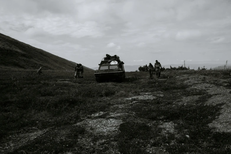 a boat sitting on top of a lush green hillside, a black and white photo, unsplash, figuration libre, several soldiers, abandoned vehicles, background image, nina tryggvadottir